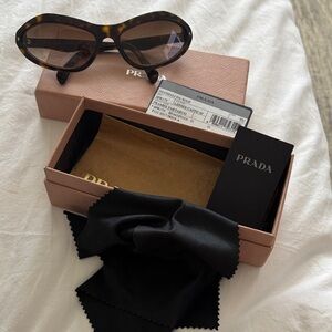 Prada Women's Tortoiseshell Oval Sunglasses with Brown Lenses